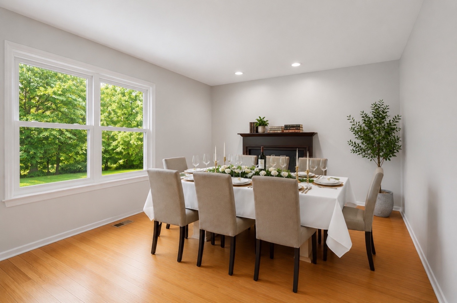 Formal dining room set for eight beside a picture window